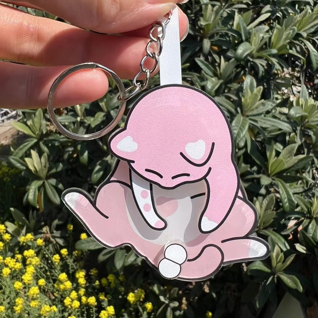 Playing with eggs and kitten keychain