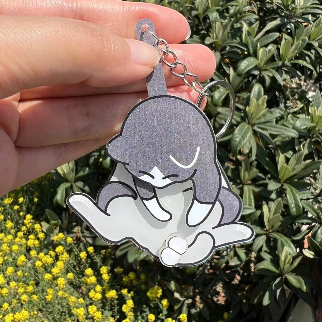 Playing with eggs and kitten keychain