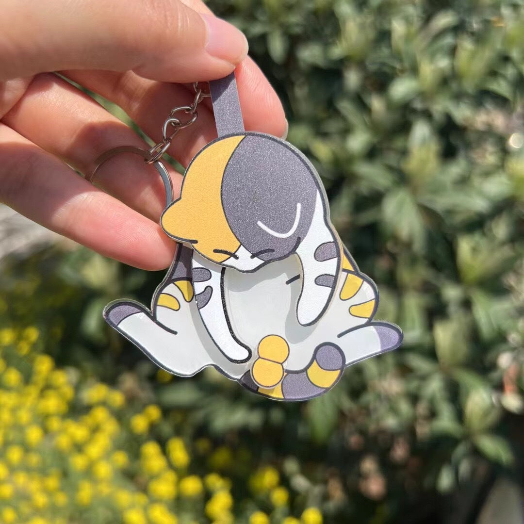 Playing with eggs and kitten keychain